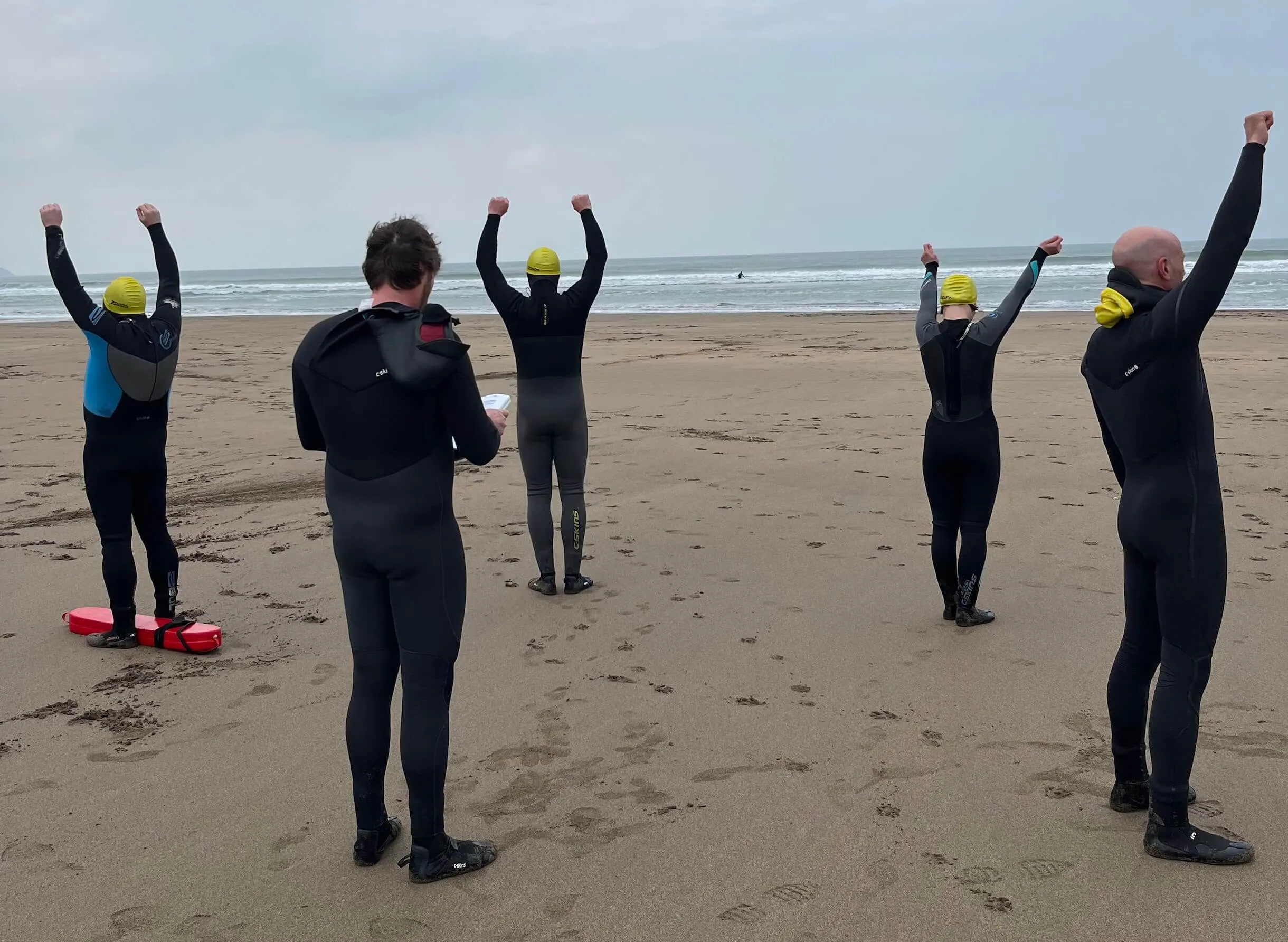 beach lifeguard trainees being tested on beach lifeguard signals