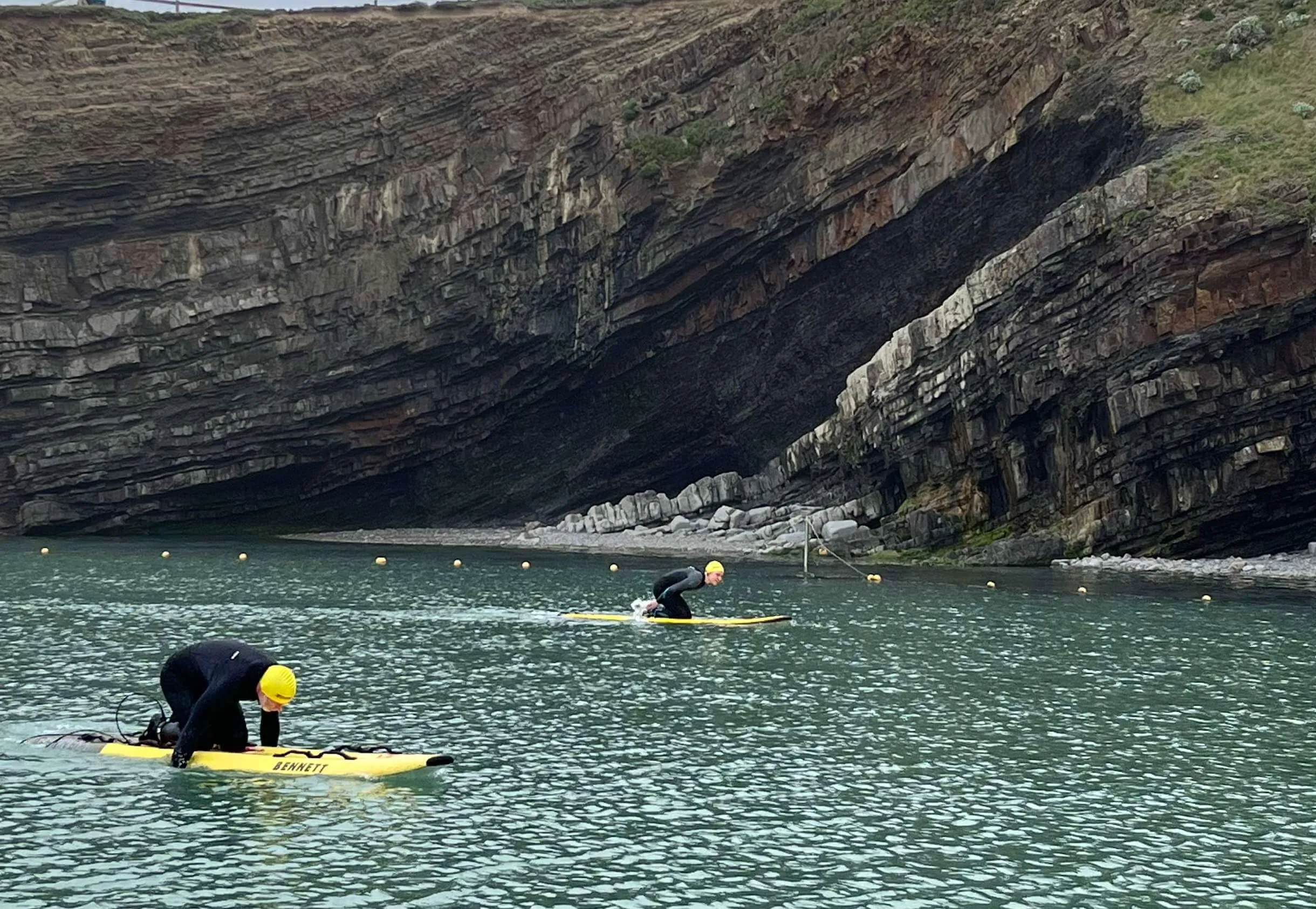 rescue board paddling on the bude sea pool
