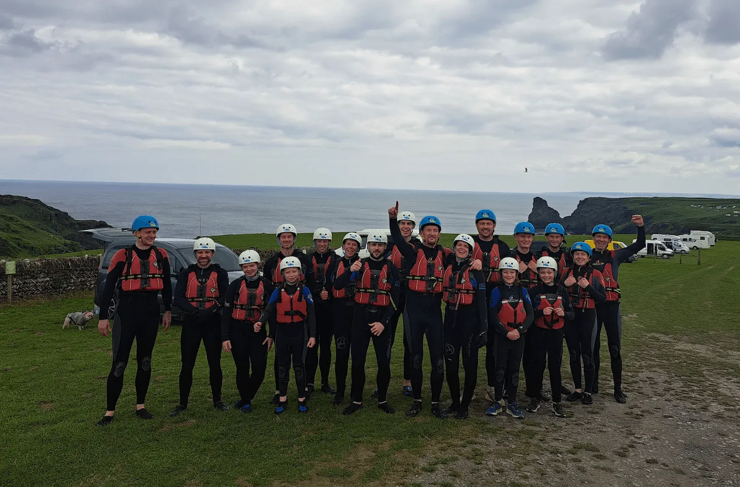 a group of families and friends before coasteering at bossiness cove