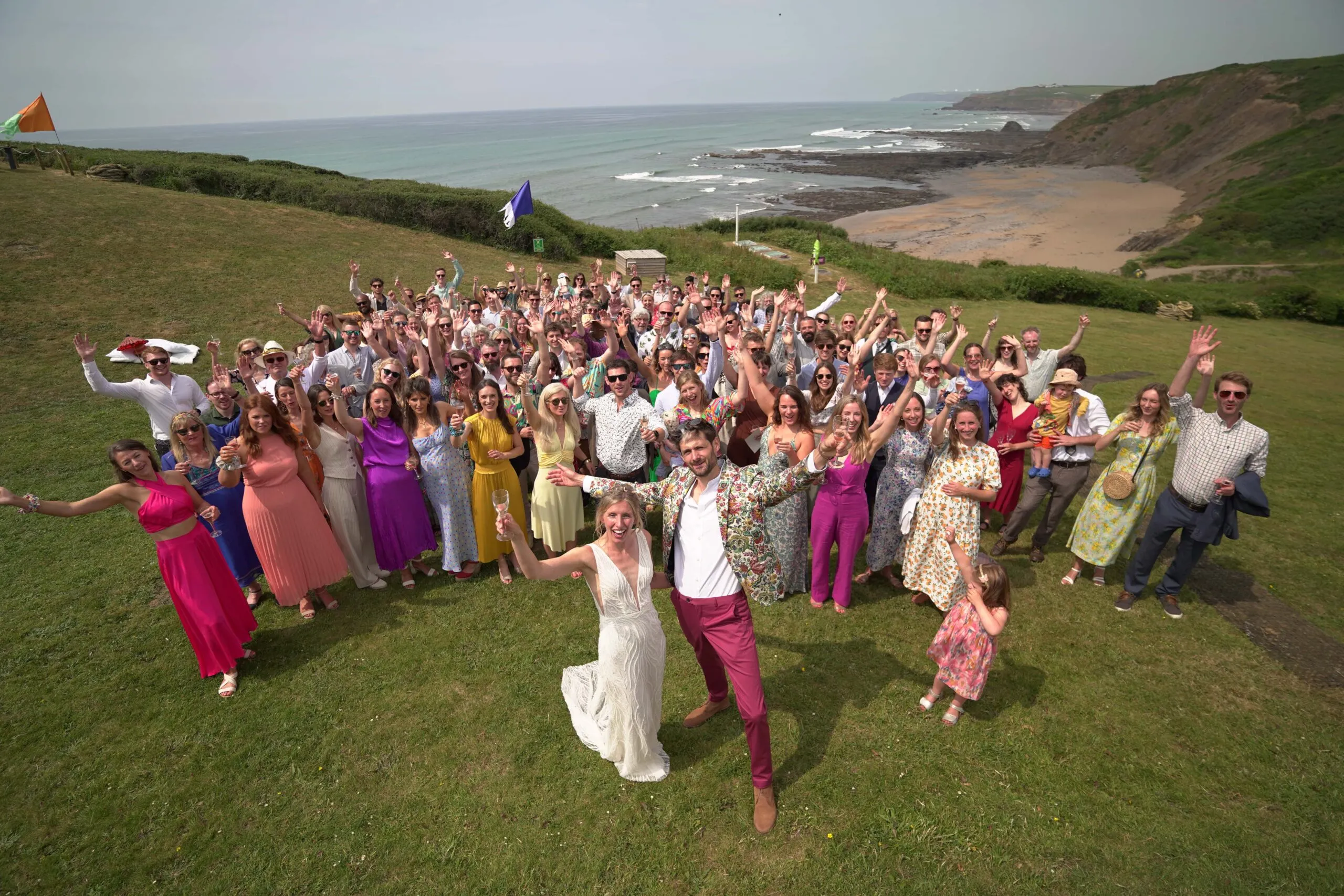 wedding party group photo with the happy couple with 100 guests