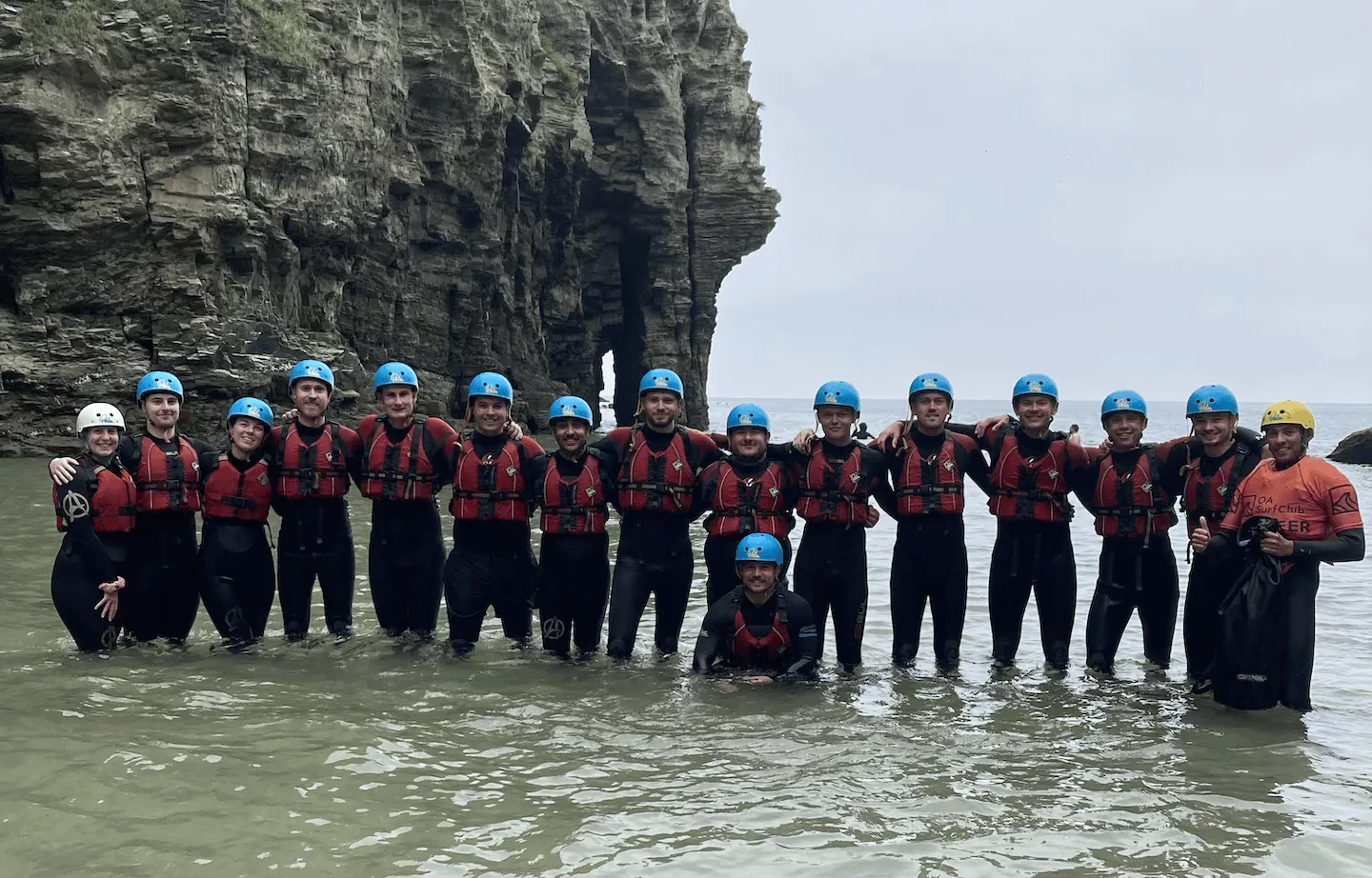 stag group standing in the water at Bossiney Cove after coasteering